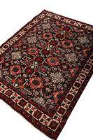 Angled view of entire rug showing geometric pattern and border