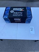 Closed box packaging of Pouring Masters acrylic pouring paint set with labeling showing 48 colors, Ready to Pour series, 2 oz bottles.