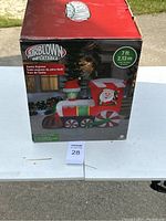 Box of the Airblown Inflatable Santa Express Train showing brand, size (7 ft), and image of the inflatable Santa train.