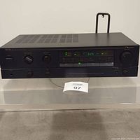 Overall top and side view of Nakamichi TA-1 amplifier showing ventilation slots and overall body condition.