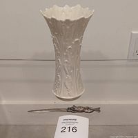 Full view of Lenox vase and frog letter opener placed on surface, showing size comparison and condition