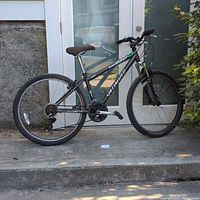 Full side view of the Specialized Hardrock mountain bike showing frame, wheels, and drivetrain.