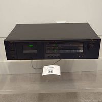Full front view of Nakamichi CR-1A cassette deck on shelf