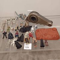 Full view of all Star Wars Clone Wars action figures and models arranged on a flat surface, showing variety and condition.