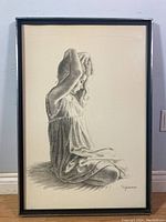 Full view of framed monochrome watercolour painting depicting a young girl adjusting her hair, signed Spencer at bottom right.