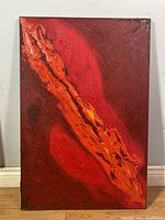 Full front view of the red abstract oil painting with orange central design and textured surface.