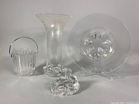 Group photo shows four crystal pieces: vase, ice bucket, polar bear sculpture, Orrefors bowl