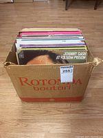 Box of vintage vinyl albums with visible covers including Johnny Cash at Folsom Prison