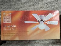 Front of the box showing brand, model Lincoln, description of reversible blades, motor housing, and 30-inch diameter.