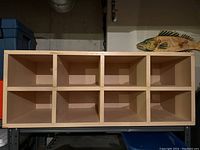 Wooden shoe rack organizer with 8 cubbies, natural wood finish, rectangular design.