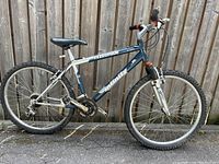 Side view of the Telluride Infinity mountain bike showing frame, wheels, and front suspension.