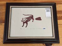 Full view of the framed Inuit woodblock print depicting an animal figure with numbering and signature below.