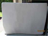 Full view of mattress upright showing geometric pattern on cover