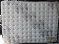 Full view of mattress top surface showing tufted quilting and pattern