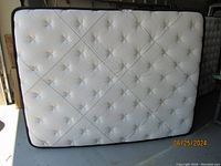 Full upright view of queen mattress showing overall condition