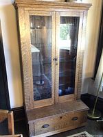 Front elevation of full cabinet showing double glass doors and lower drawer