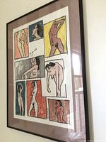 Angled view of framed pastel nude art showing multiple colorful figures with signature and date