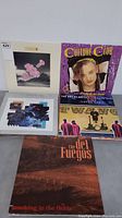 Five vinyl LP albums arranged side by side showing cover art including Culture Club, The Art of Noise, Del Fuegos, Level 42, and one other.