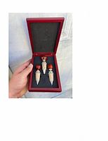 Set of 3 wood and silver wine stoppers with cork seals in fitted case, held in hand, photo to show condition and presentation