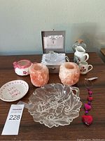 Full view of lot on table showing all items including Waterford Crystal box, salt candle holders, ceramics, plate and glass dish.