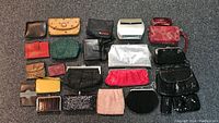 Overview of evening bag purses in various colors, materials, and brands showing size and style variety