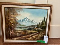 Full view of the framed oil painting showing mountain scene, path, cabin, trees, and signature by Benson