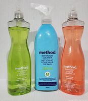 Front view of three bottles: lime & sea salt dish soap, eucalyptus mint bathroom cleaner, and clementine dish soap.