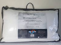 Photo of the Dream by Gluckstein Home temperature enhancing pillow package showing label with product name, size, and support level.