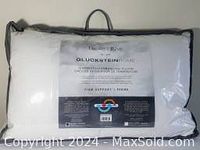 Front view of the white pillow in packaging showing label with brand and product details