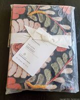 Packaged new Pottery Barn Helena Embroidered Floral Percale Standard Sham showing front label and bow.