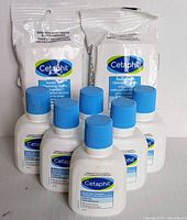 Front view of six Cetaphil Gentle Skin Cleanser 60 ml bottles and two packs of Cetaphil Gentle Skin Cleansing Cloths (10 cloths each).
