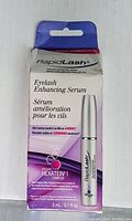 Front photo of unopened RapidLash Eyelash Enhancing Serum box showing product name, size 3 ml (0.1 fl oz), and key ingredient Hexatein 1 Complex