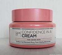 Front view of pink jar showing product name Confidence In A Cream Surface Cell Renewal Rosy Tone Vitality Moisturizer for aging skin.