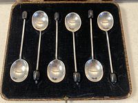 Six sterling silver coffee spoons in black velvet lined presentation box