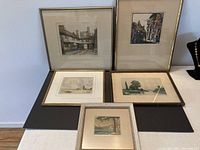 Five antique etchings and watercolors framed, arranged on surface to show full lot.
