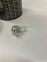 Close-up photo of the Swarovski Silver Crystal fish figurine showing its clear crystal body, silver accents on fins, and distinct eyes.