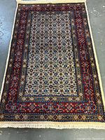 Full view of Persian wool carpet showing pattern and dimensions