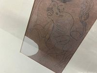 Close-up of lithograph line drawing detail on brown paper.