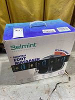 Box front showing brand Belmint Press Escape Shiatsu Foot Massager with visible image of the product and logo