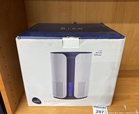 Front view photograph of new boxed Miko Ibuki S air purifier showing product image and aroma diffuser feature.