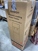 Photo of the Avalon bottom loading water cooler box shows the model and brand clearly.