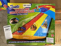 Box packaging showing full product name and colorful image of the triple lane water splash slide with children using bodyboards.