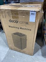 Boxed Deco Home portable washing machine showing front packaging with brand and product image.