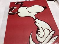 Red hardcover book front cover showing large Snoopy illustration and the name Schulz in gold.