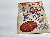 Front cover shows illustrated football players in action, listing Canadian football teams from 1956 and sponsor Northern Electric Company Limited.