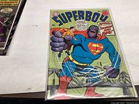Photo showing the front cover of Superboy comic book issue #142 with a large gorilla character holding Superboy.
