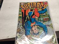 Photo of Superboy comic book issue #143 showing front cover and title details.