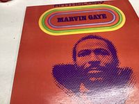 Front cover of the Marvin Gaye Anthology vinyl showing colorful retro design and a pixelated image of Marvin Gaye.