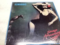 Front cover of the Scorpions Savage Amusement vinyl record, showing some wear and a little scratch.
