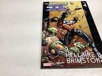 Photo of the comic book Ultimate X-Men Vol 4 Hellfire & Brimstone with Wolverine on cover.